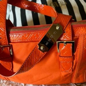 RAD RARE orange LAMB purse BY GWEN STEFANI. EUC